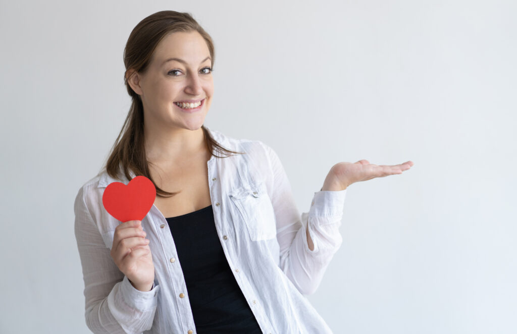 <a href="https://www.freepik.com/free-photo/smiling-pretty-woman-holding-paper-heart-empty-space_3801742.htm#fromView=search&page=1&position=1&uuid=fdaf9a54-1788-4cd0-ae7a-484c106176f0">Image by katemangostar on Freepik</a>