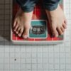 a man standing on a weighing scale