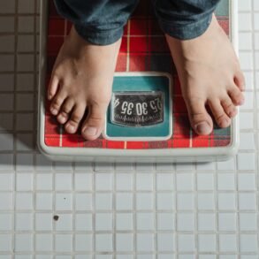 a man standing on a weighing scale