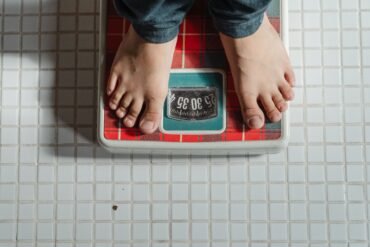 a man standing on a weighing scale