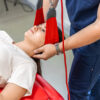 female-patient-hanging-suspensions-rehabilitation