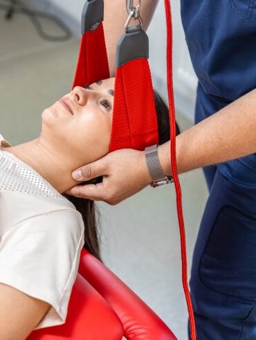 female-patient-hanging-suspensions-rehabilitation