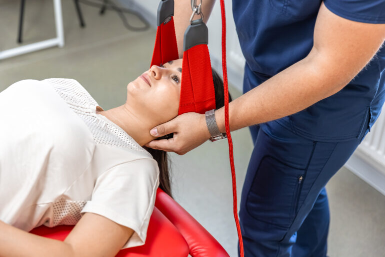 female-patient-hanging-suspensions-rehabilitation