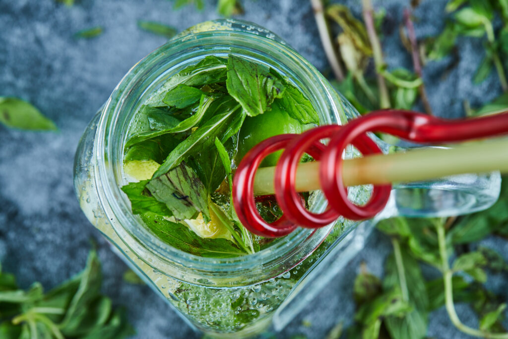 mojito cocktail with slices lime mint blue table with fresh mint leaves