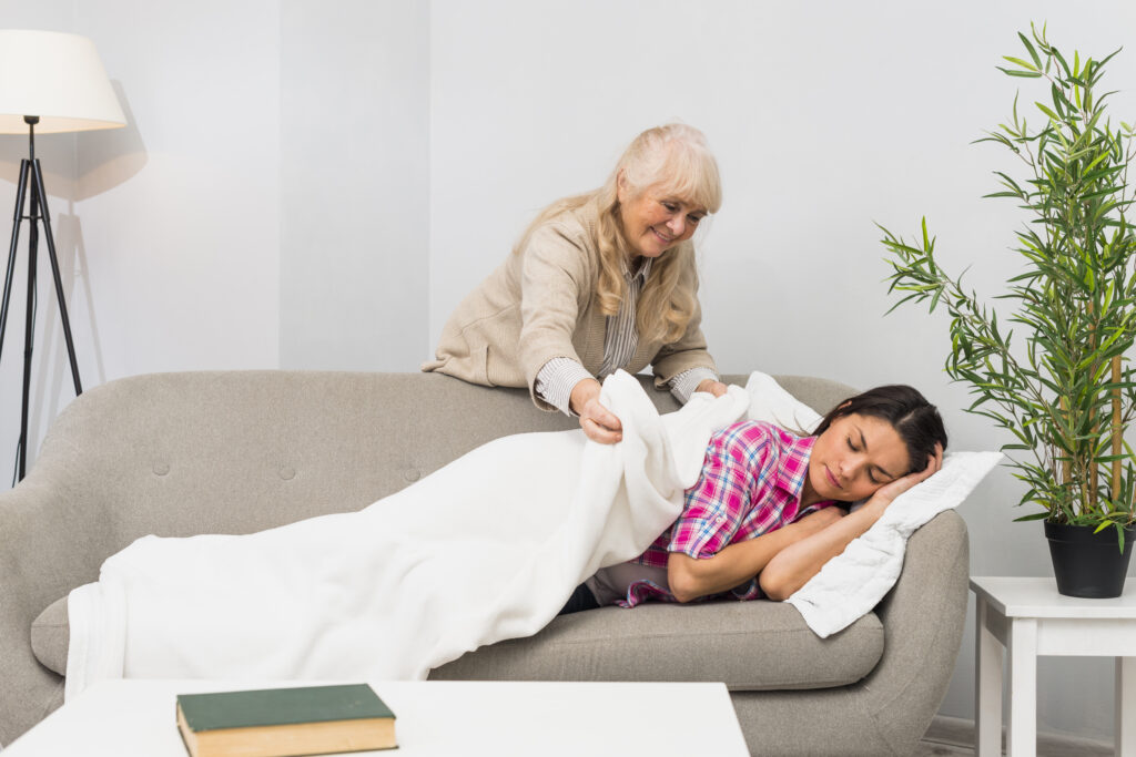 mother putting a blanket over hr daughter using satvamind restoration therapy