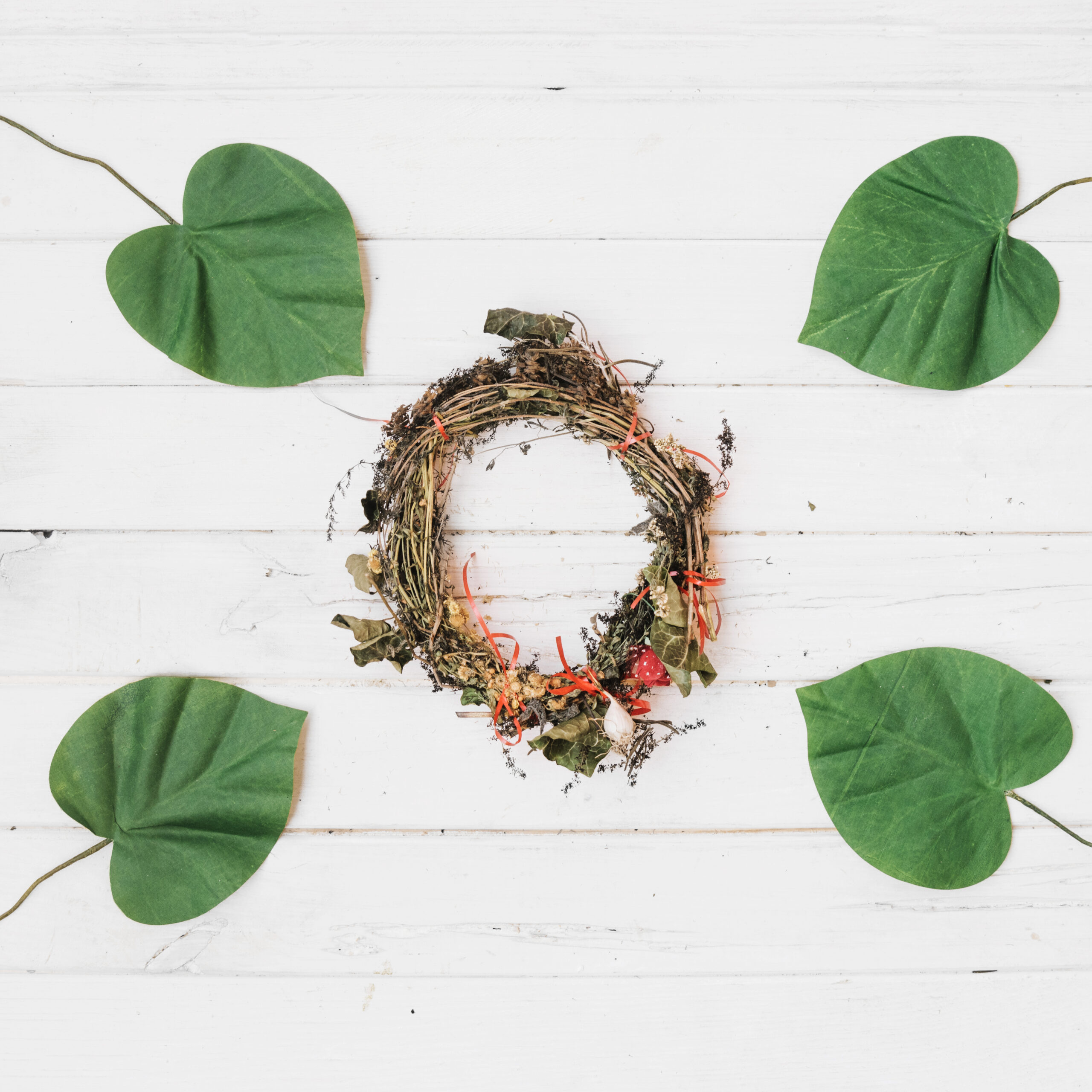 dried wreath leaves scattered in four parts for Ancient Ayurvedic Burnout Recovery