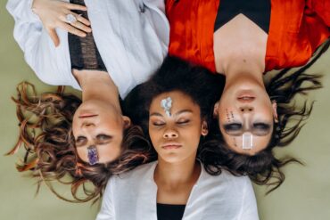 three women lying down