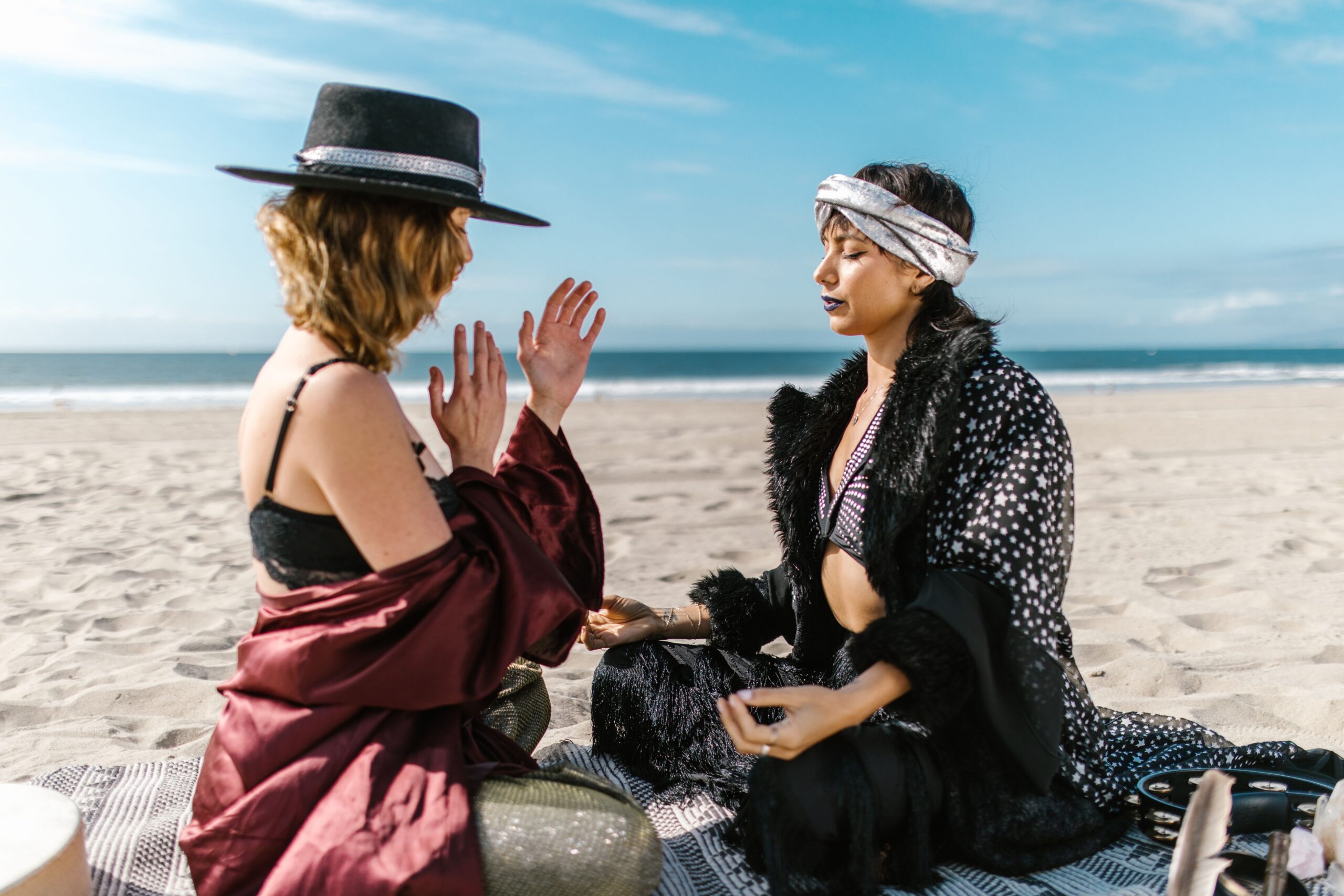 two women doing yoga poses in a desert for Ayurvedic Wellness Principles