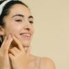 a girl massaging her face