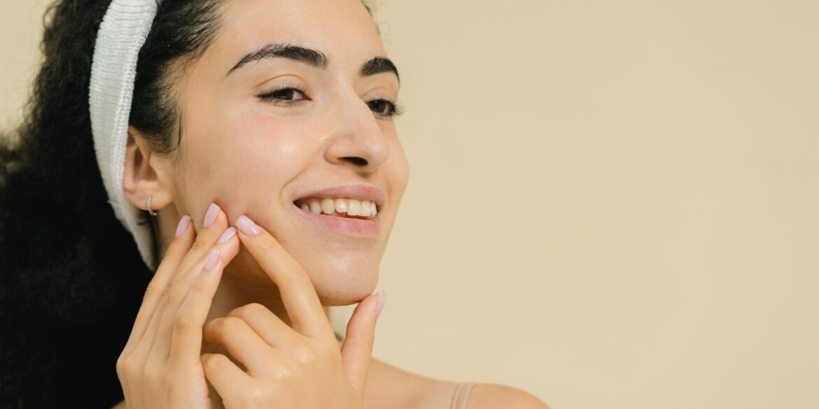 a girl massaging her face