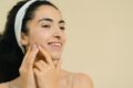 a girl massaging her face