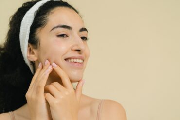 a girl massaging her face