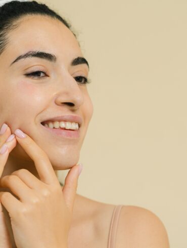 a girl massaging her face