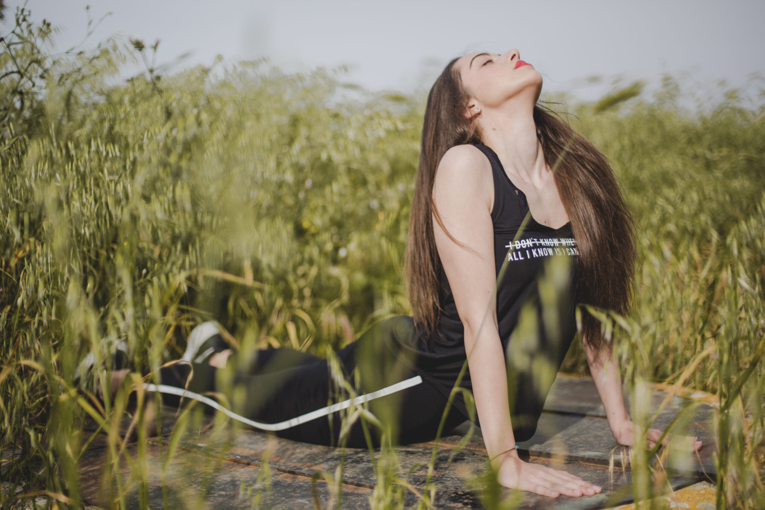 woman lying stretching in a field