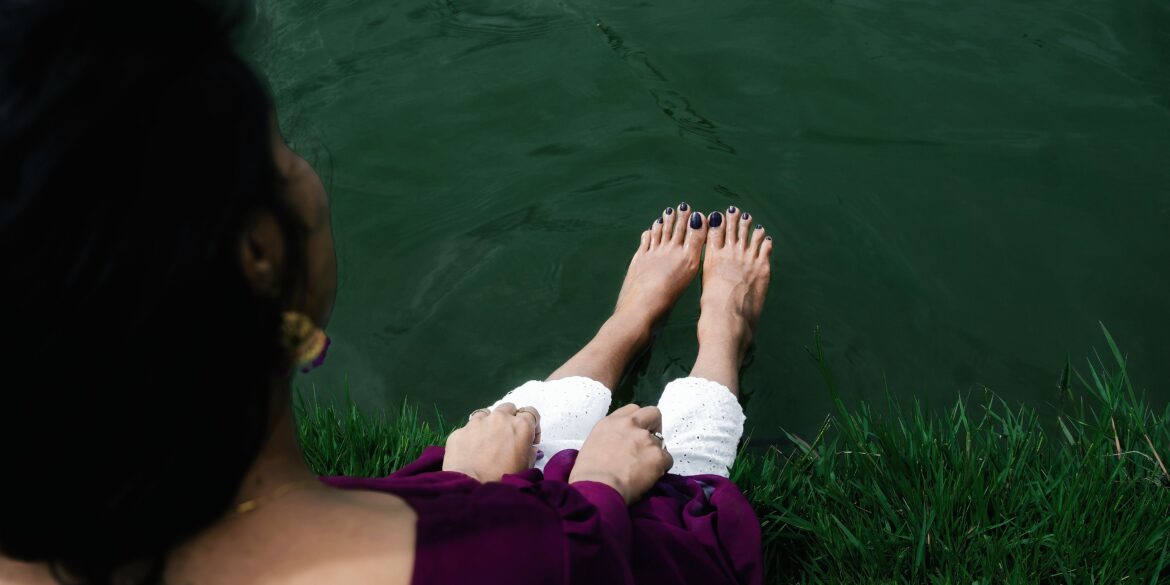woman sitting with her legs spread out