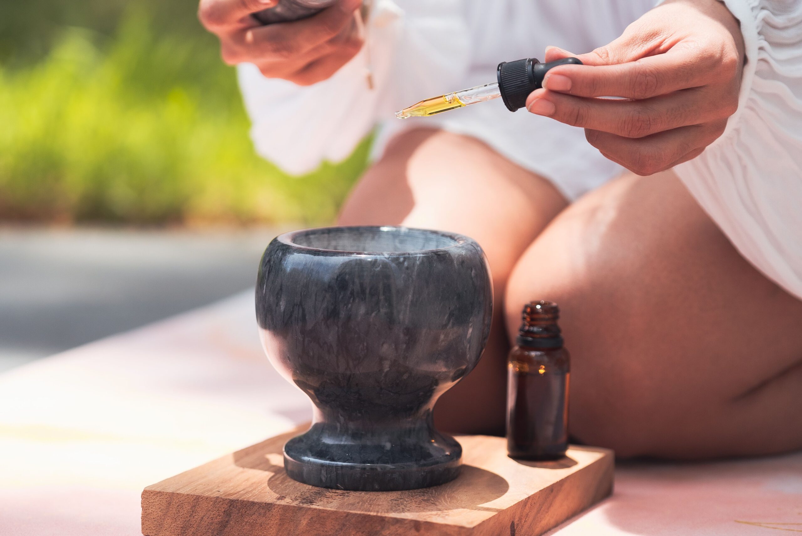 ayurvedic ointment being poured in a bowl for Ayurvedic Self-Healing
