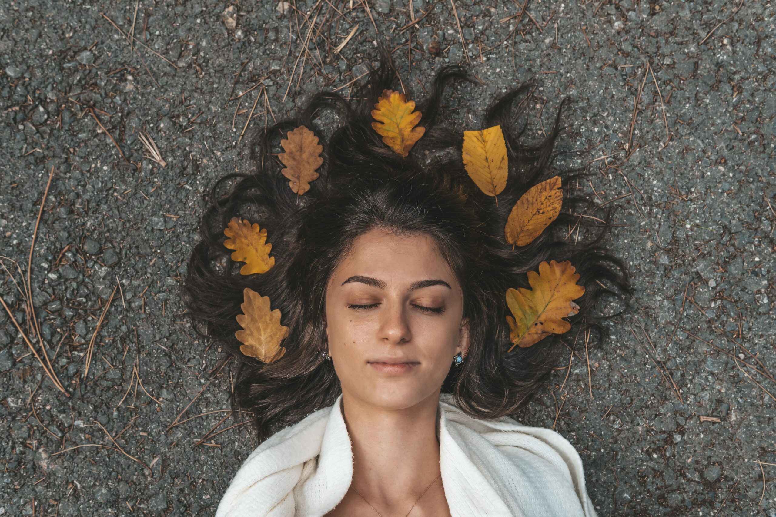a woman laying with her hair spread out for Ayurvedic Nervous System Reset