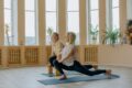 two healthy old man and woman doing a yoga pose
