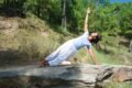 a woman doing yoga in nature