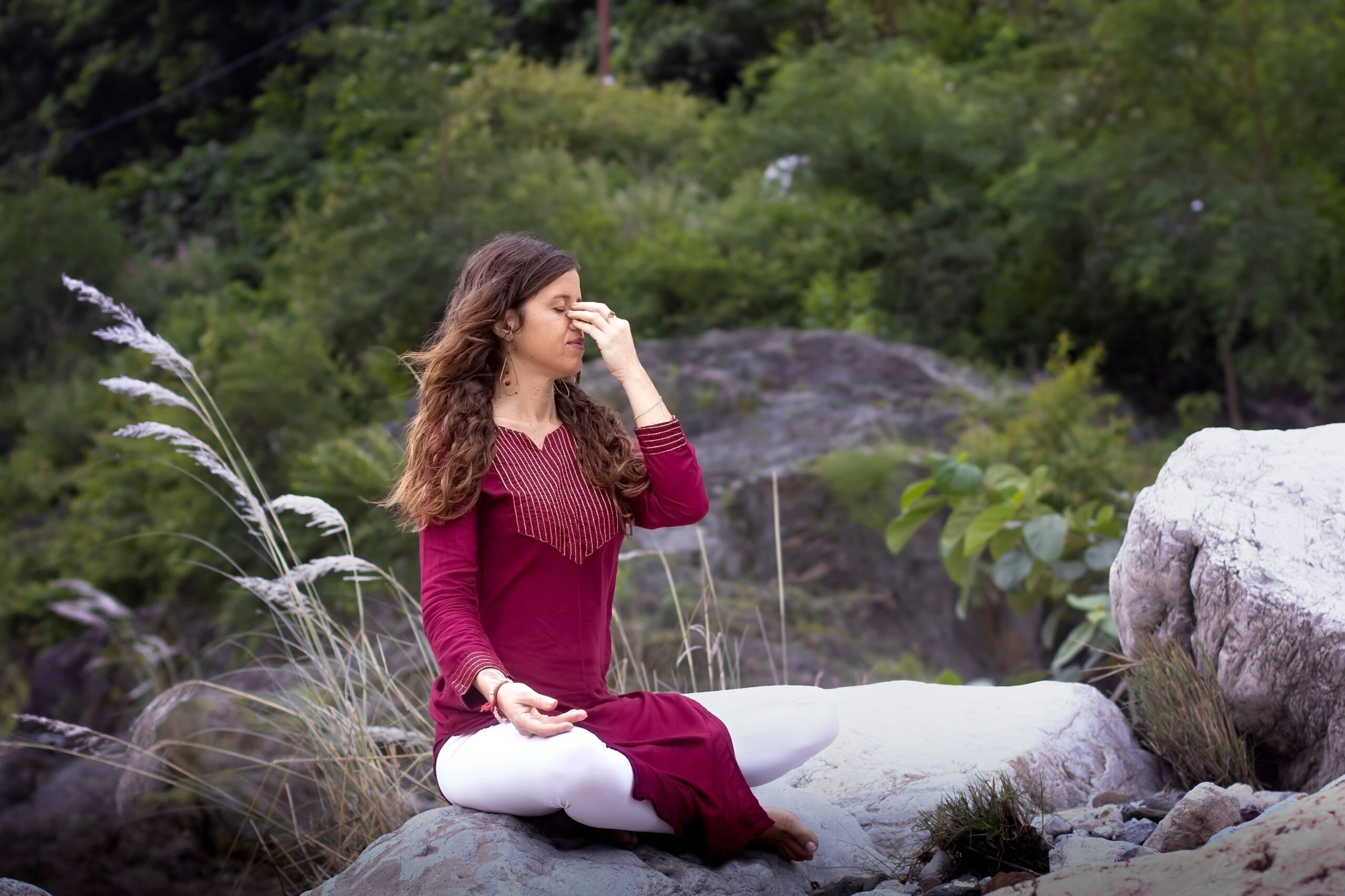 woman doing pranayaam in nature for Ayurvedic Nervous System Reset