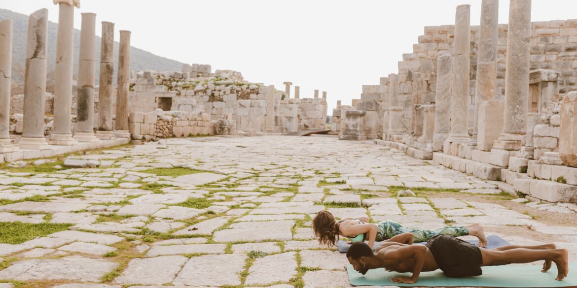 two people doing yoga poses
