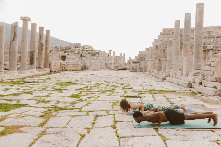two people doing yoga poses