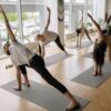 people in a yoga studio doing yoga together