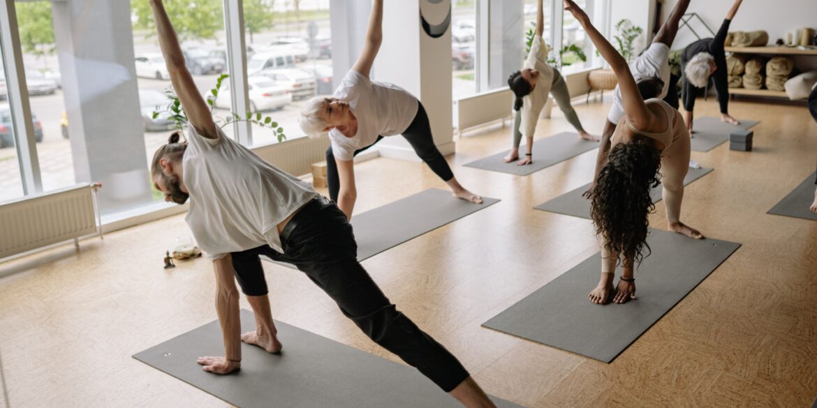 people in a yoga studio doing yoga together