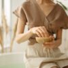 girl crushing ayurvedic herbs in a bowl