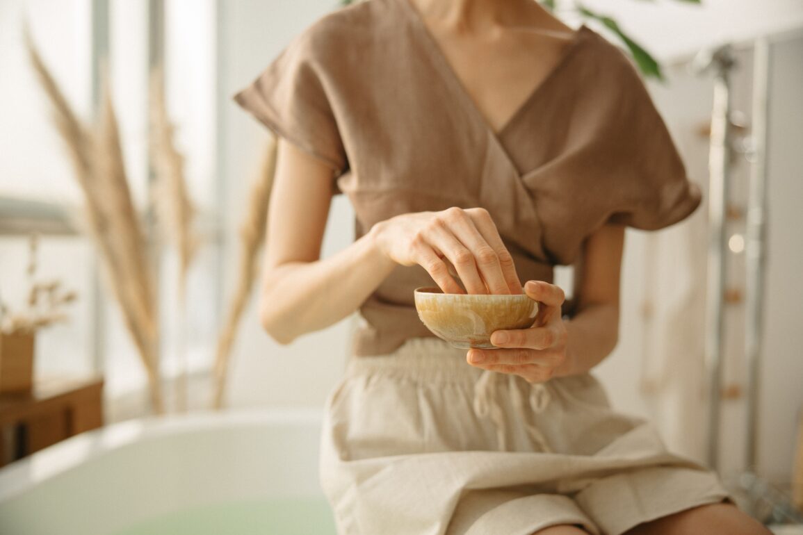 girl crushing ayurvedic herbs in a bowl