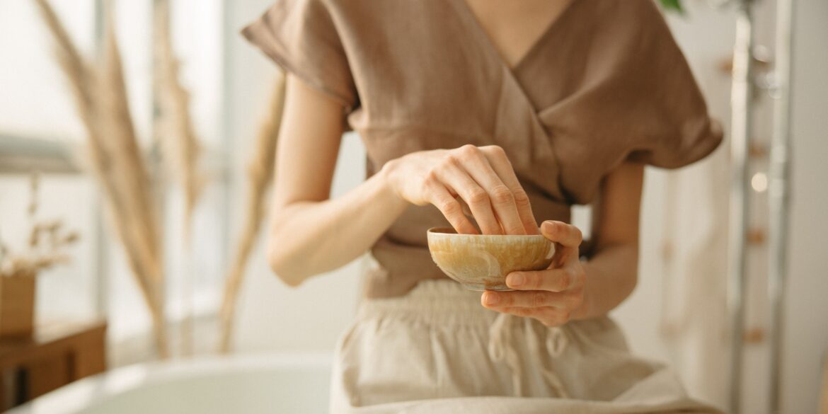 girl crushing ayurvedic herbs in a bowl