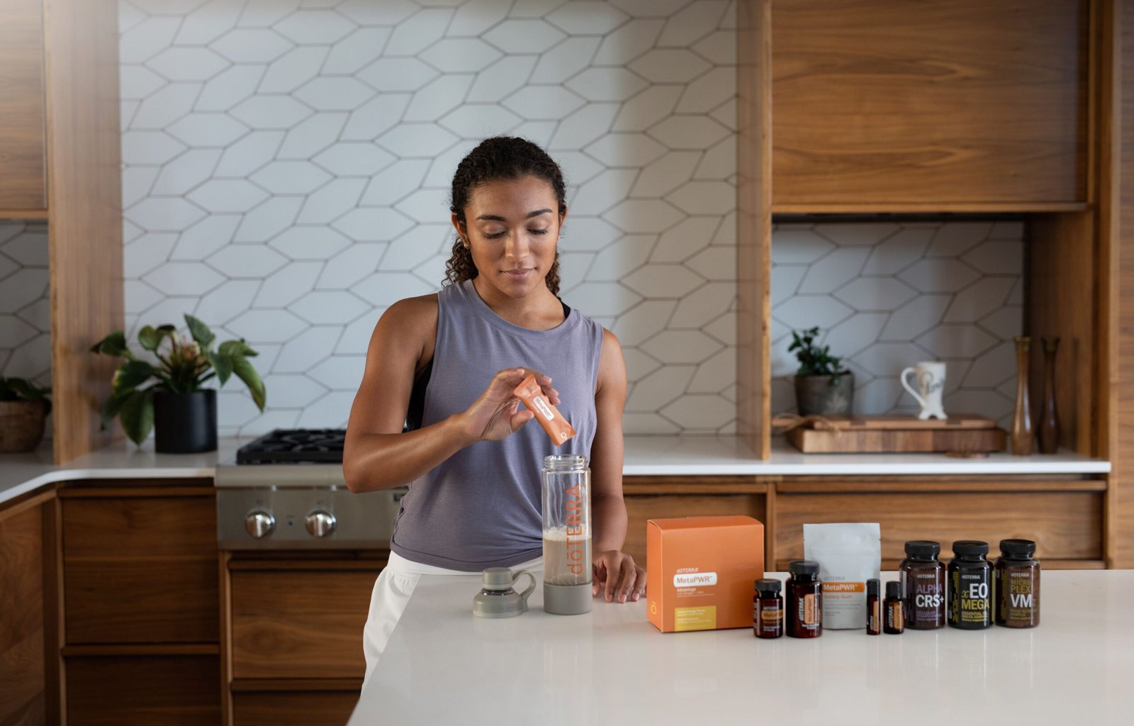 a woman mixing protein powder in glass of water for metabolic health