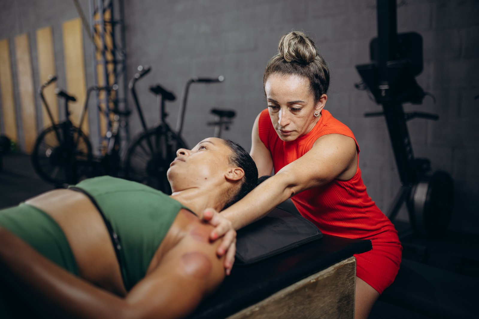 a physiotherapist massaging a woman for Ayurvedic Muscle Recovery