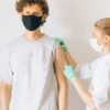 a man getting vaccinated on his forearm