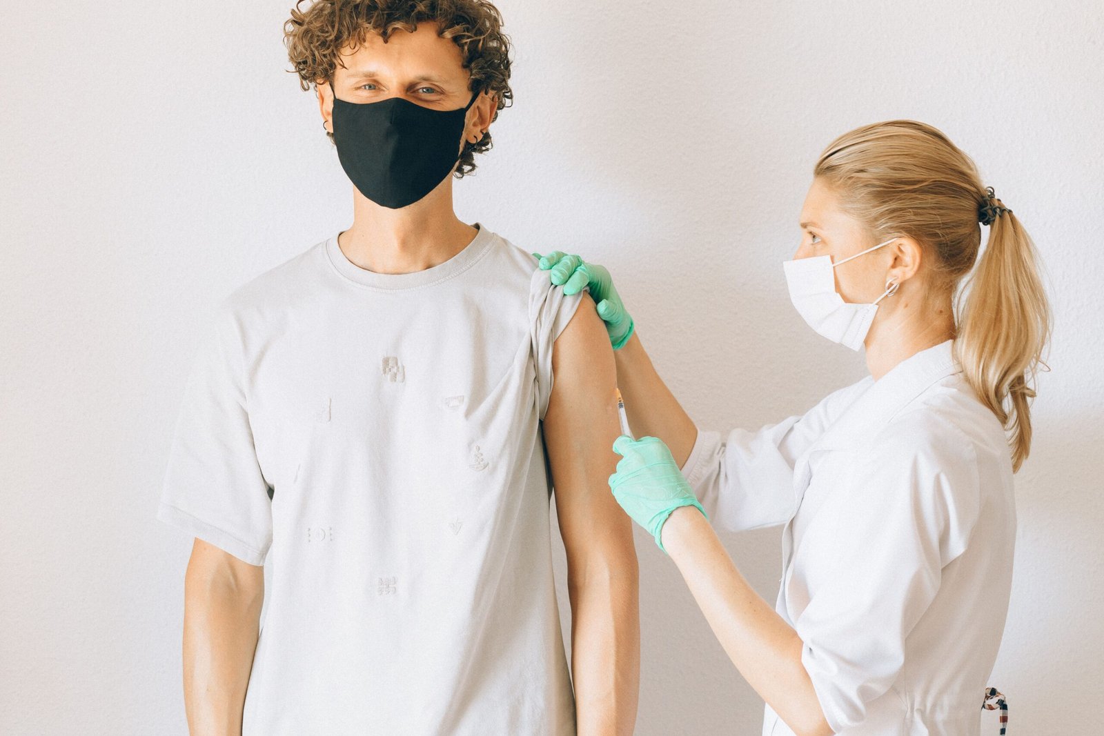 a man getting vaccinated on his forearm