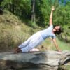 a woman doing yoga in nature for The Ayurvedic Fitness Blueprint