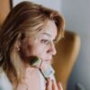 woman massaging her face