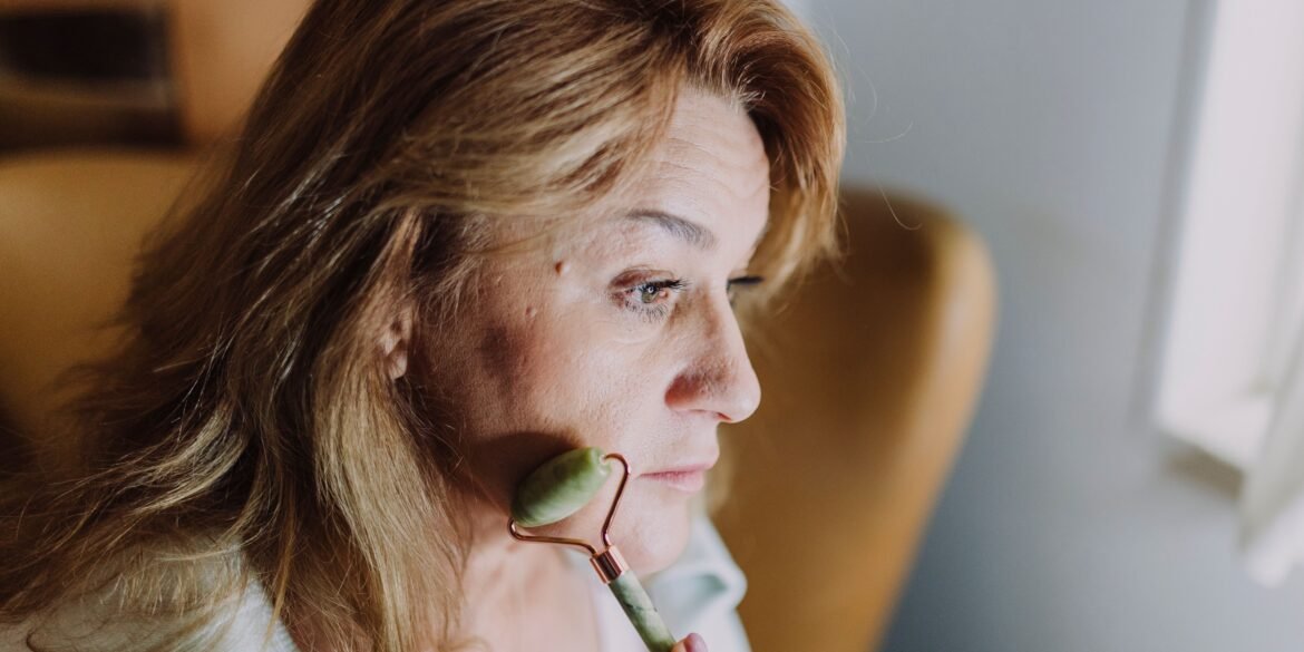 woman massaging her face
