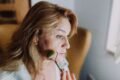 woman massaging her face