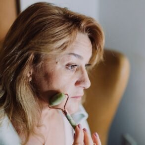 woman massaging her face