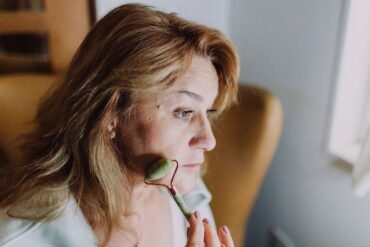 woman massaging her face