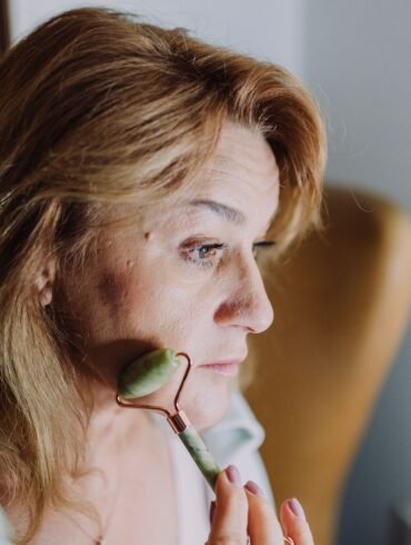 woman massaging her face