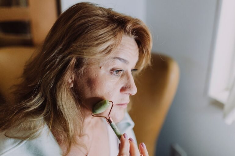woman massaging her face