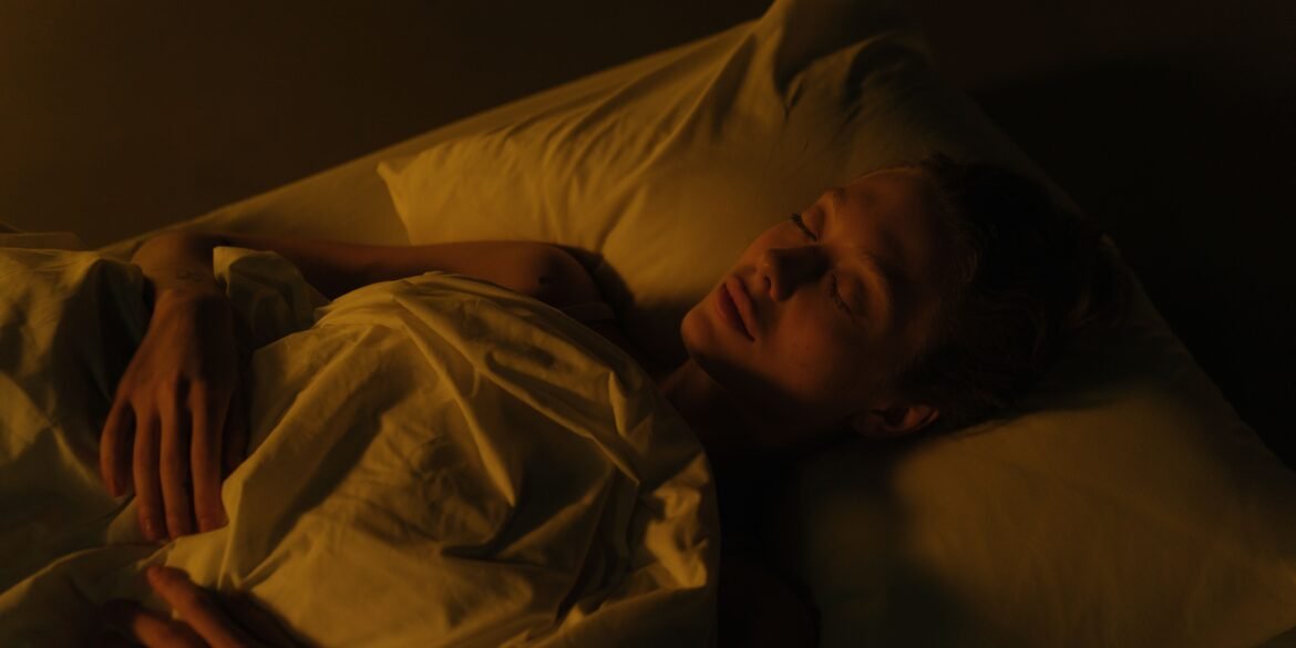a man sleeping in his bed