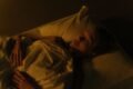 a man sleeping in his bed