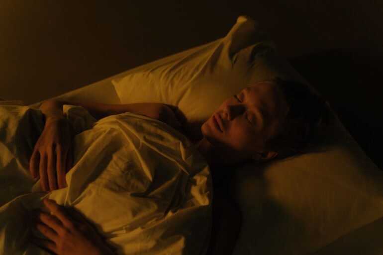 a man sleeping in his bed