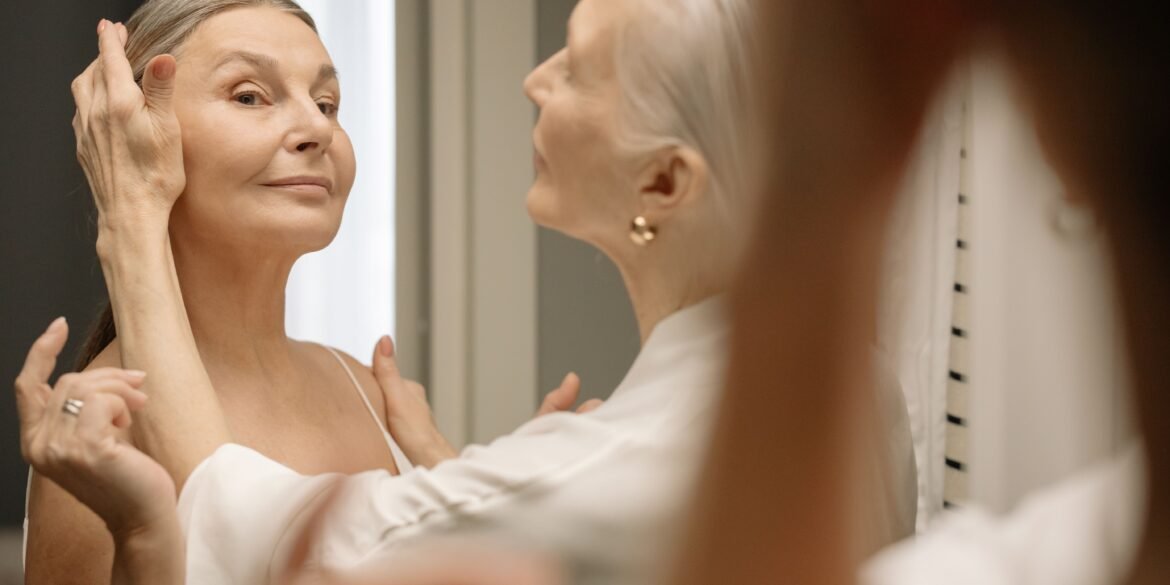 a woman helping another woman getting ready