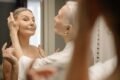 a woman helping another woman getting ready