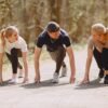 three people working out in nature