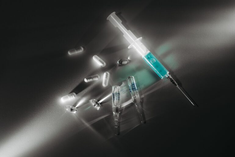 needles and injections lying on the floor for health breakthroughs